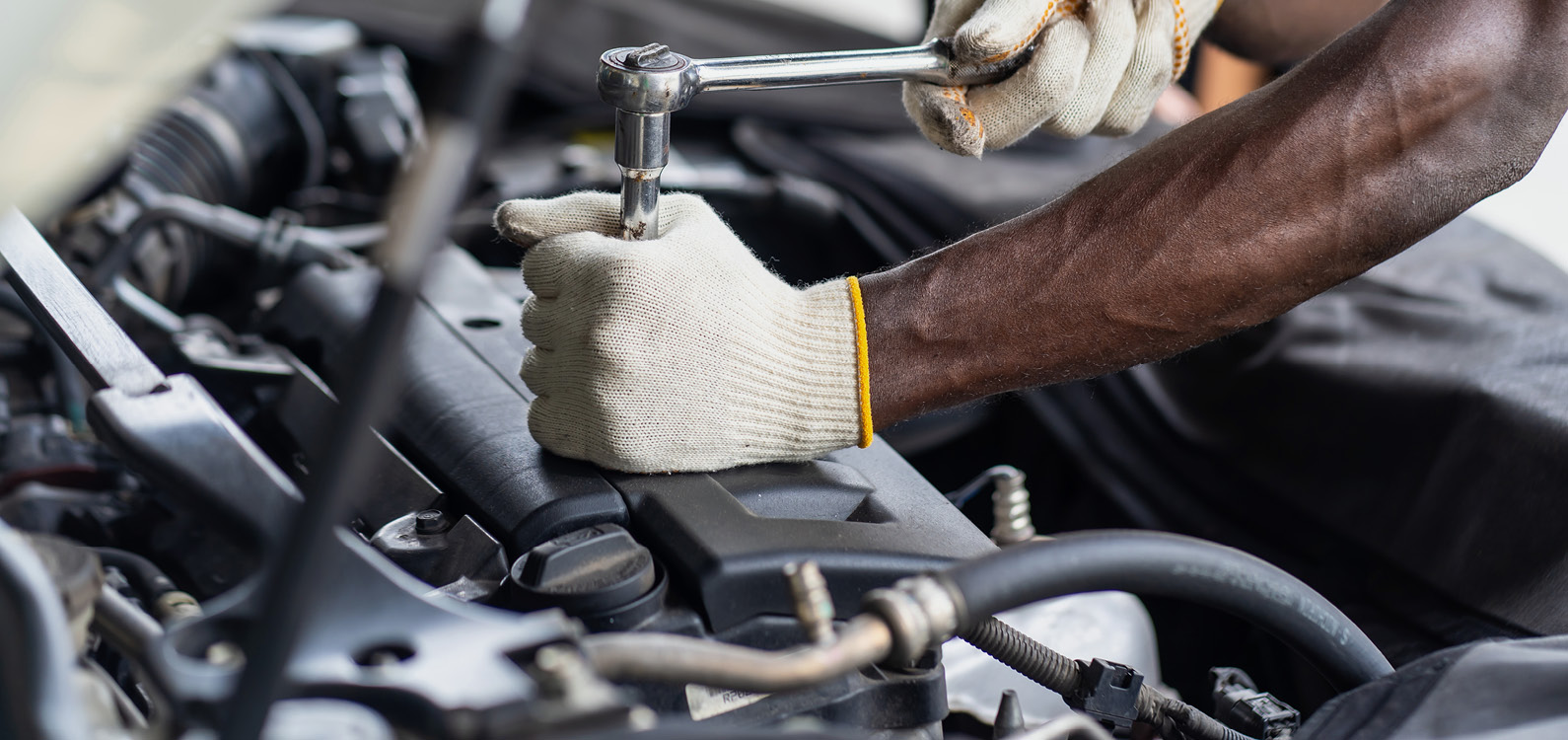 Mechanic hands working on engibe